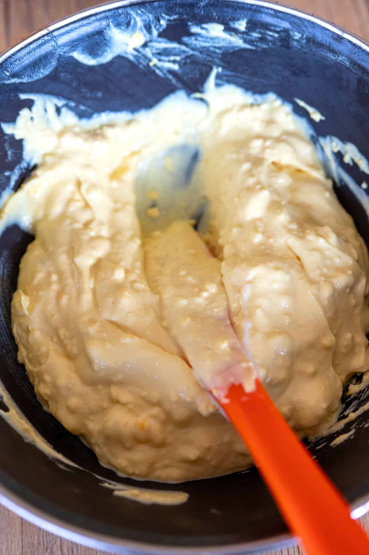 Mixing mayo and mustard with egg yolk.