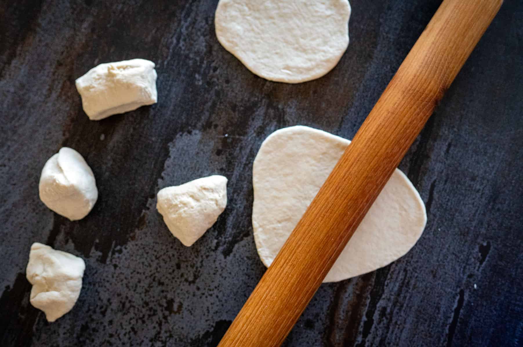 Rolling out flatbread.