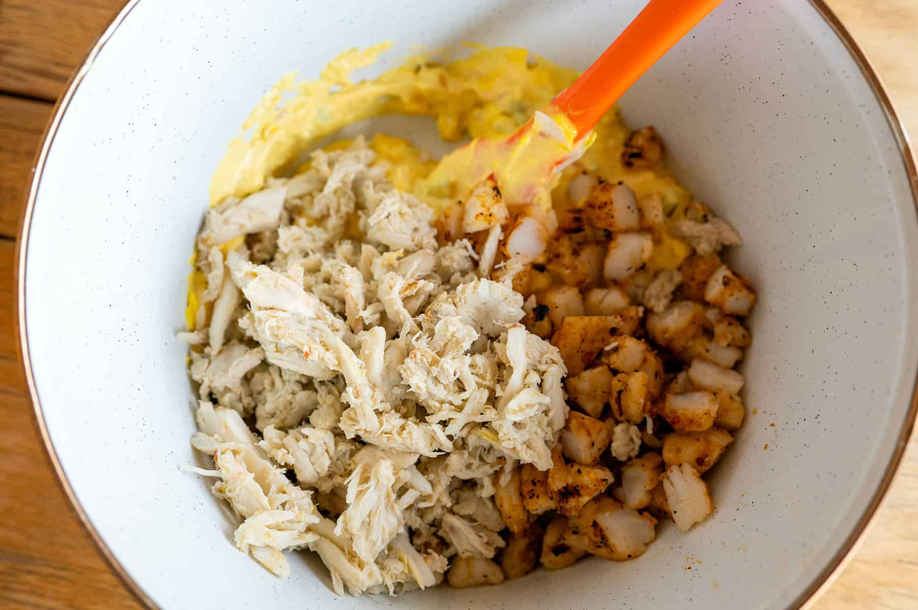 Bowl of deviled egg mix with crab and grilled shrimp.