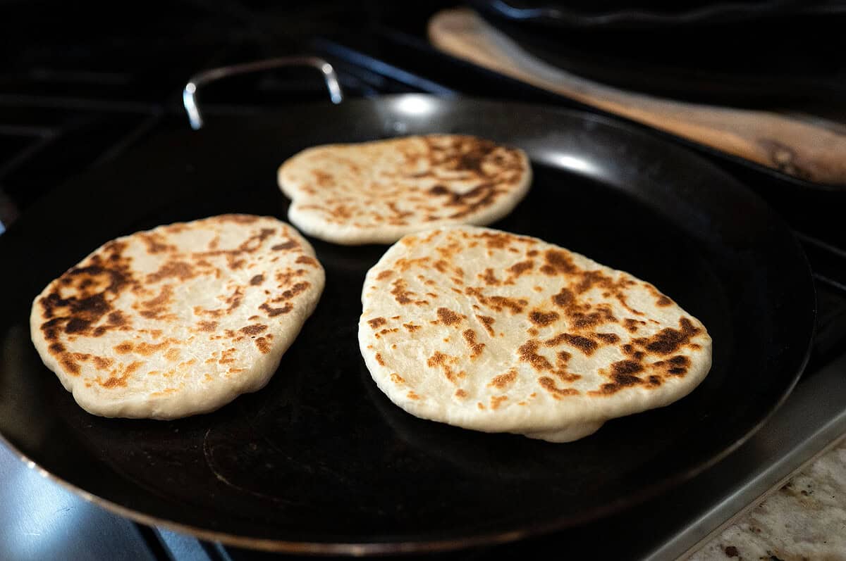 Thick flatbread on the skillet.