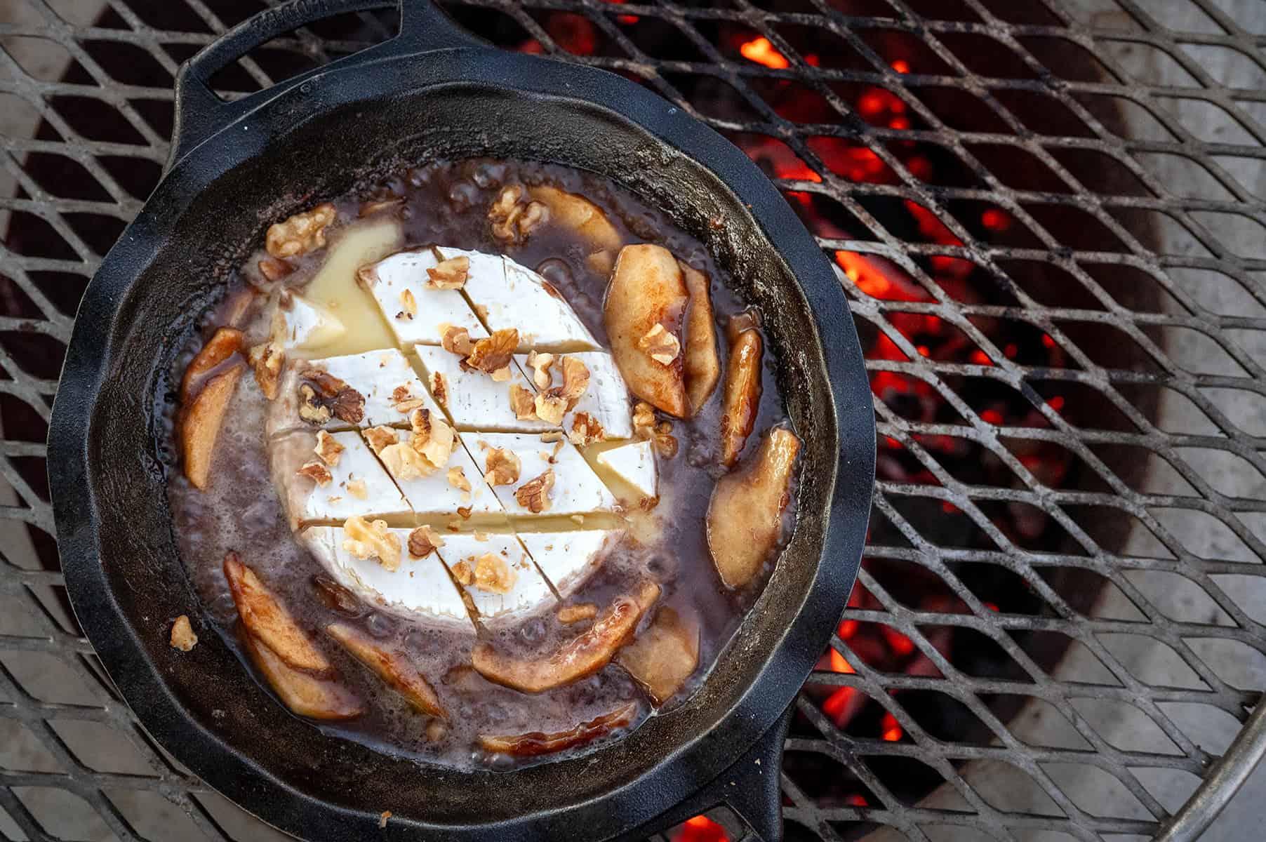 Brie melting in skillet with Apple Brie Dip.