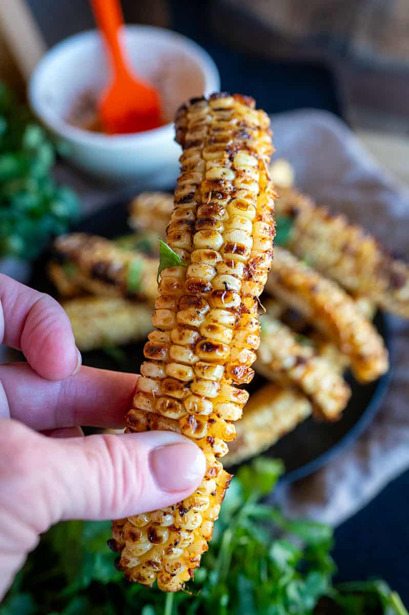 Holding Grilled Corn Ribs.